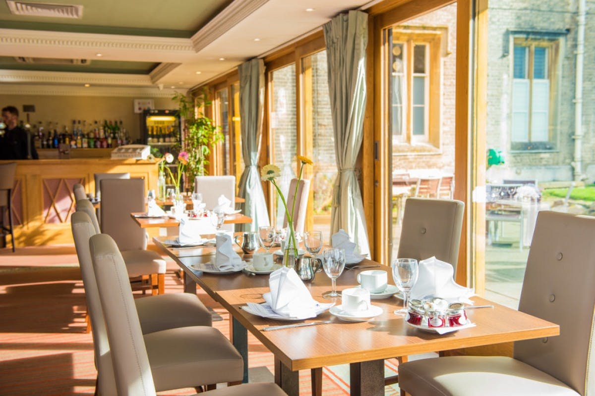 Longman Suite at Shendish Manor Hotel, elegant dining area for meetings and events.