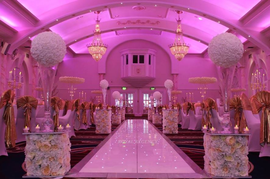 Elegant Grand Ballroom at The Royal Regency, perfect for weddings and upscale galas. - Banner