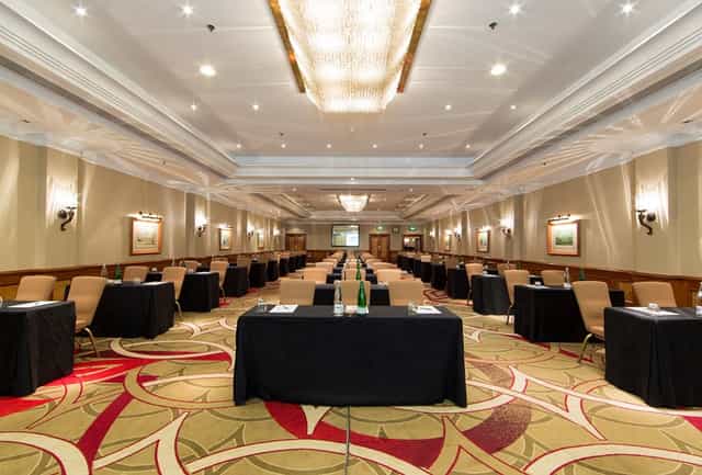 Hyde Park meeting room with black tablecloths, ideal for workshops and conferences.