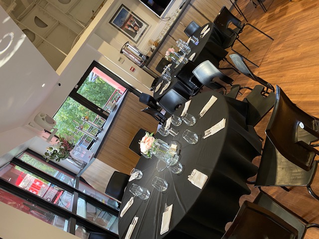 Function Room at FC United: elegant meeting space with round tables for workshops and gatherings. - Banner