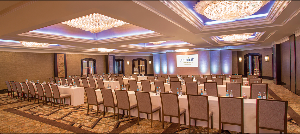 Conference room at Jumeirah Carlton Tower, elegant setup for corporate events and workshops. - Banner