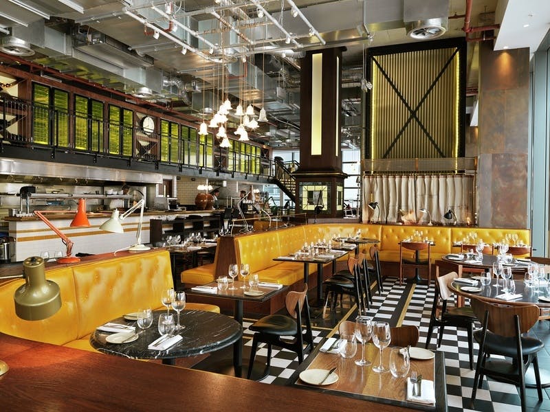 Modern restaurant venue with warm lighting, ideal for corporate events and celebrations.