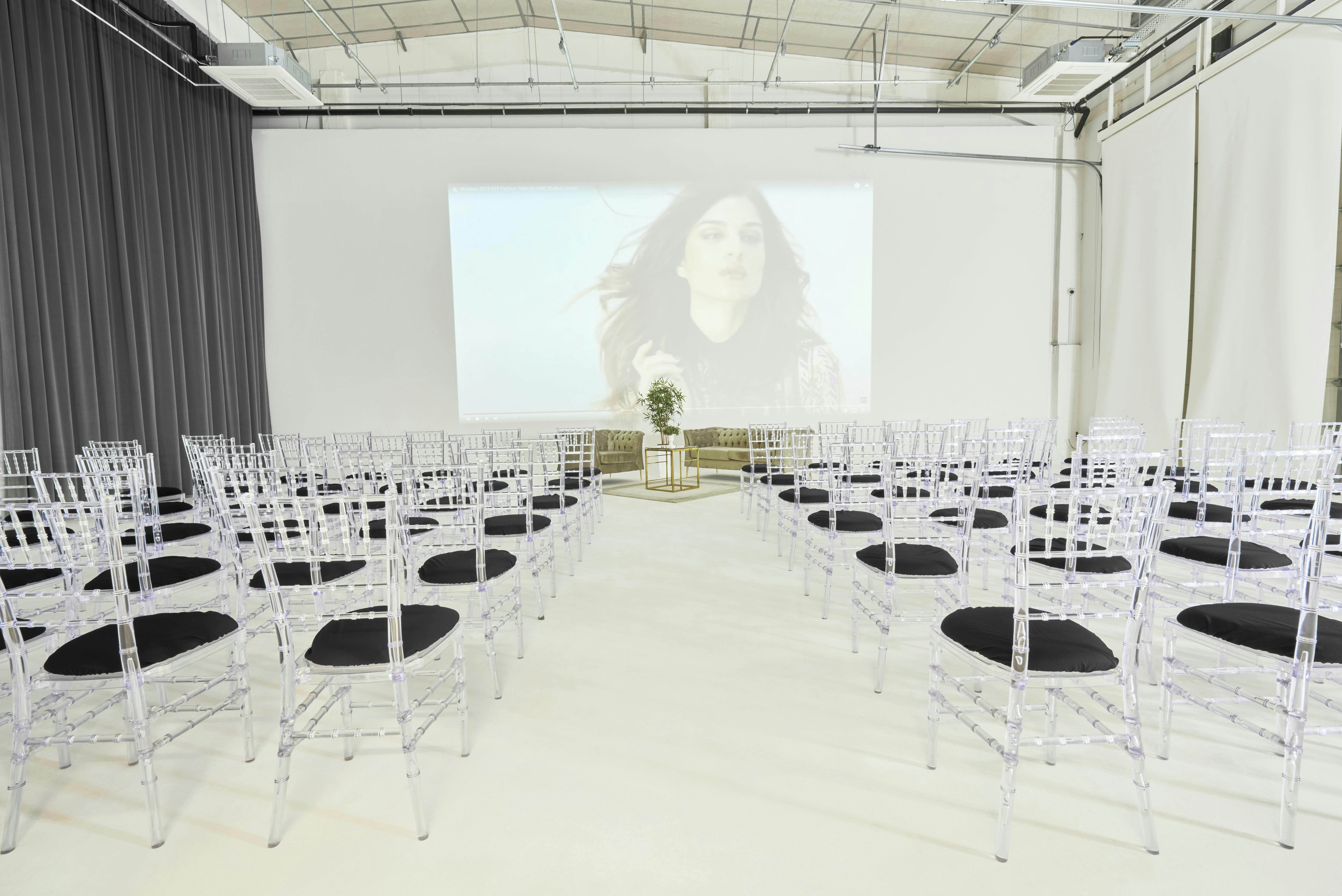 Modern event space with acrylic chairs for presentations at S2 Royal Arsenal.