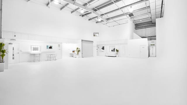 Spacious minimalist event space at S2 Royal Arsenal, perfect for corporate meetings and workshops.