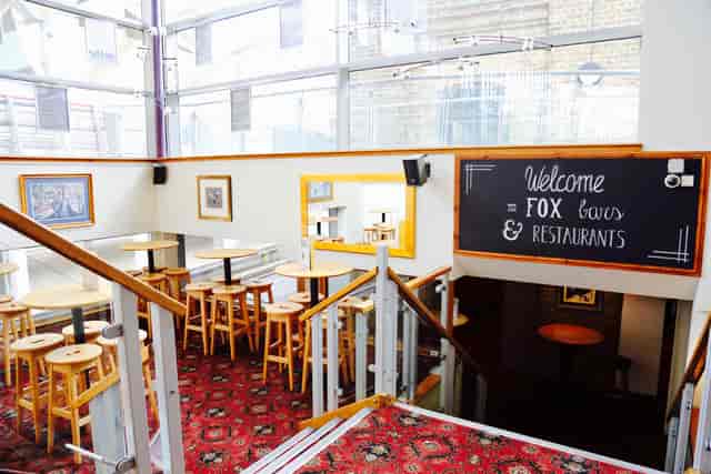 Mezzanine at Fox Excel with high-top seating for networking mixers and reception events.