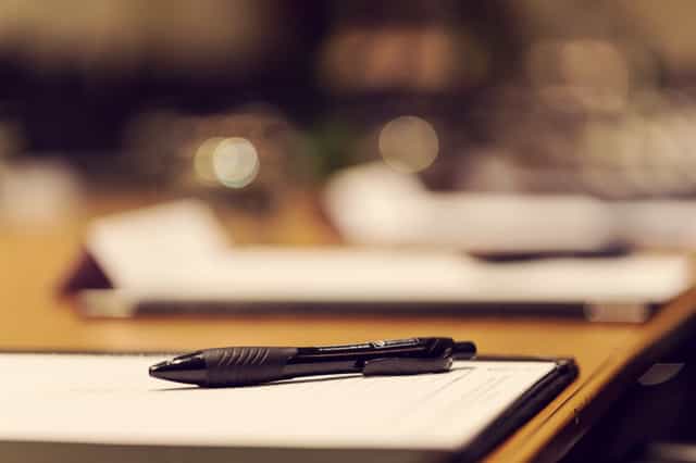 Waterhouse Suite meeting setup with clipboard and pen at Townhouse Hotel Manchester.