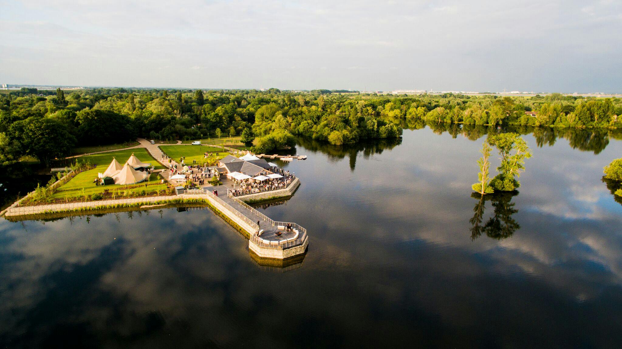 Scenic Amber Lakes venue with lush greenery, perfect for outdoor weddings and events.
