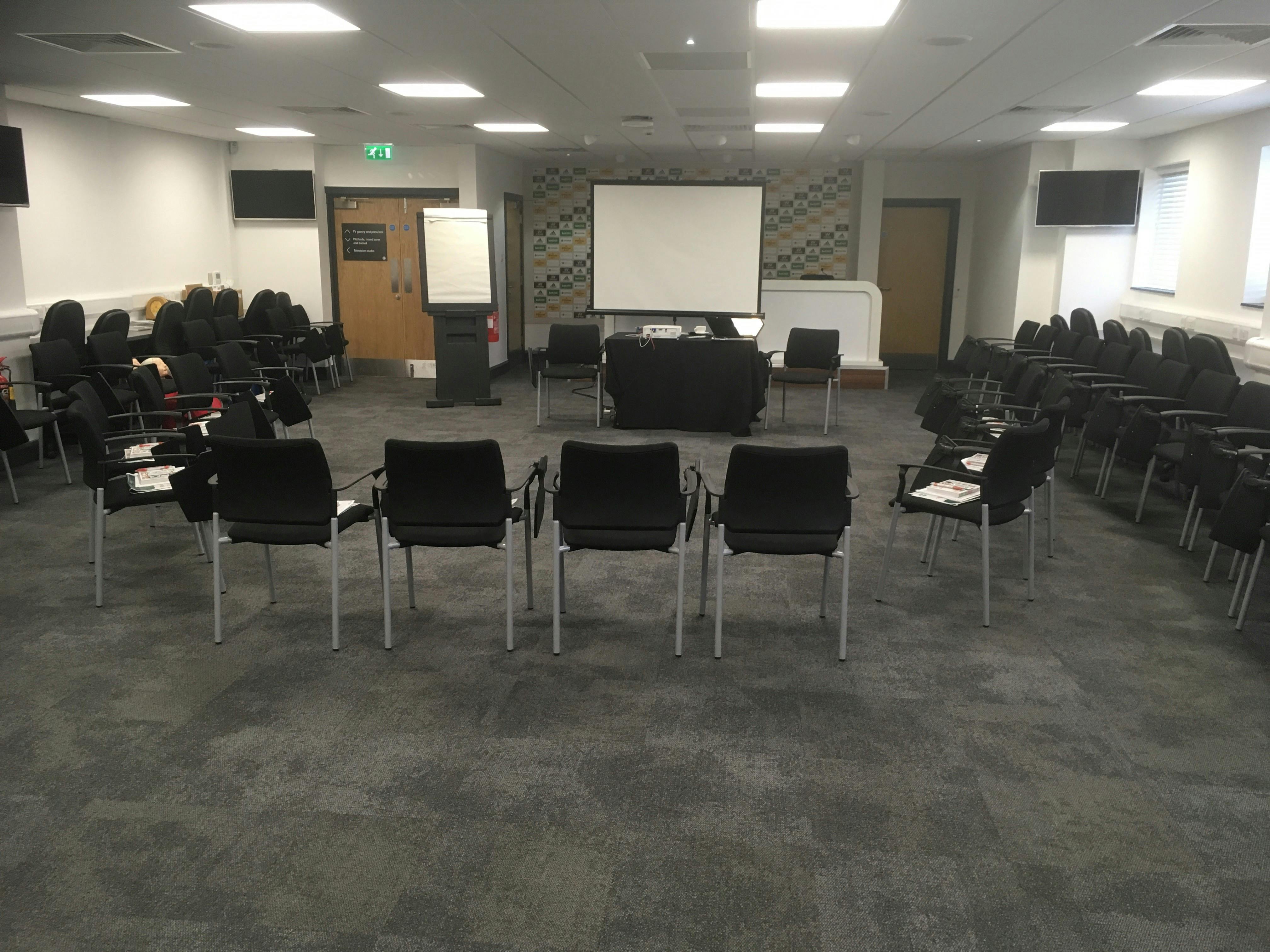 Media Suite at Molineux Stadium, circular seating for workshops and meetings.