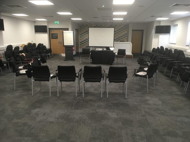 Media Suite at Molineux Stadium, circular seating for workshops and meetings.