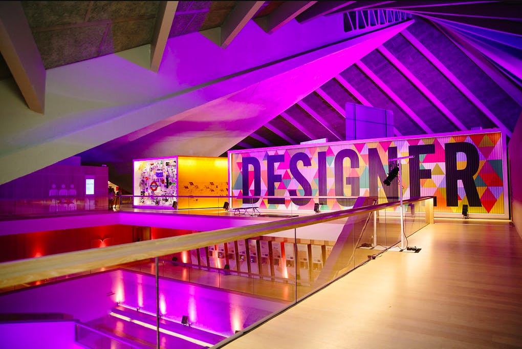Vibrant Design Museum Atrium with bold mural, ideal for creative events and product launches.