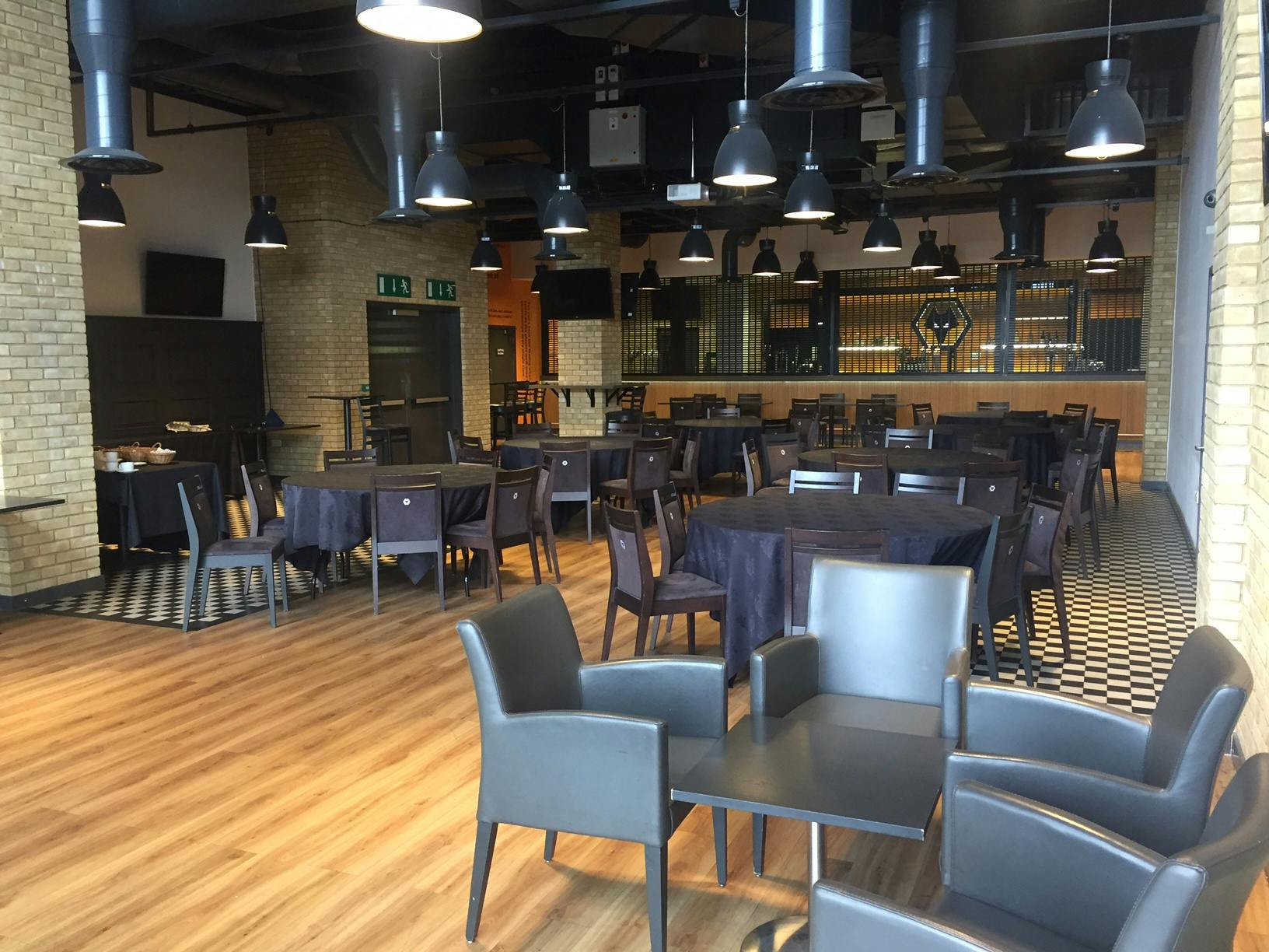 WV1 North Bank Bar at Molineux Stadium, modern event space for networking and dinners.