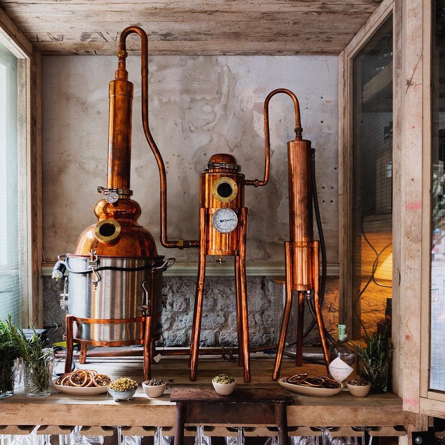 Copper distillation setup in Cocktail Lounge, Martello Hall for themed events and tastings.