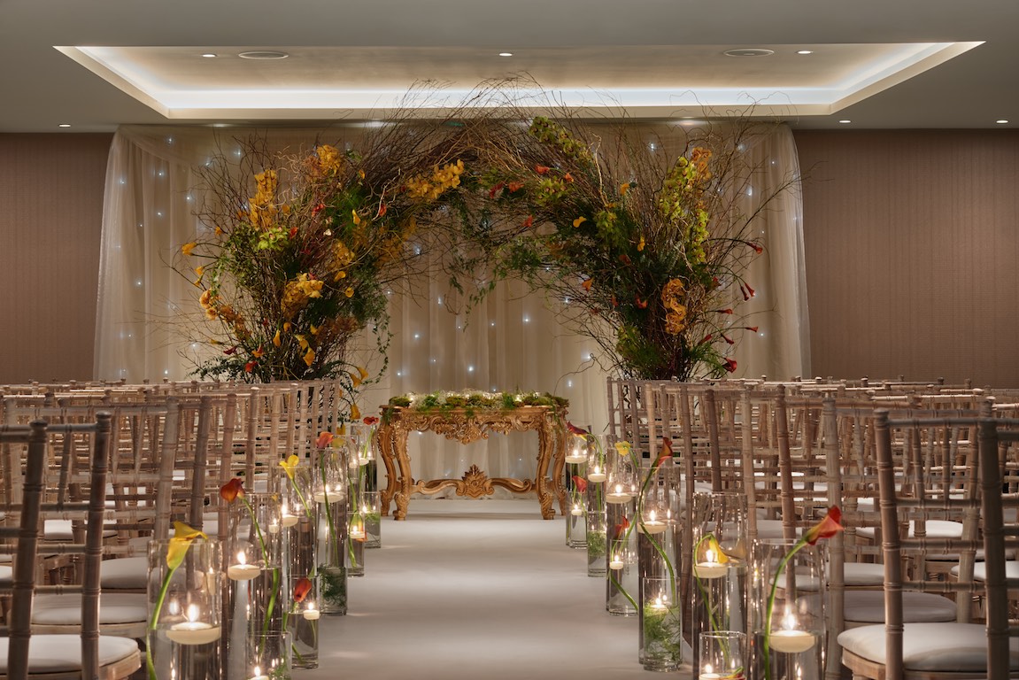 Elegant Bankside Ballroom ceremony setup with chiavari chairs and floral archway for weddings. - Banner