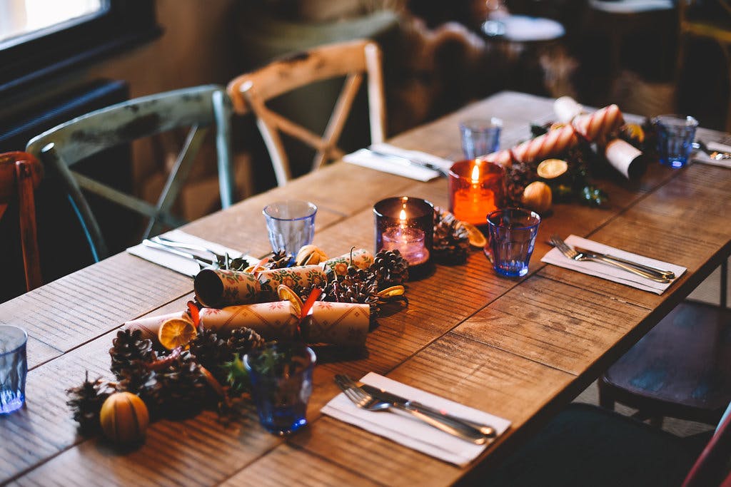 Intimate dining setup with rustic decor and blue glassware at The Islington Townhouse.