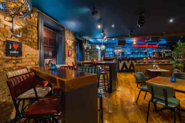 Stylish venue with warm lighting for casual meetings and social events in Manchester.