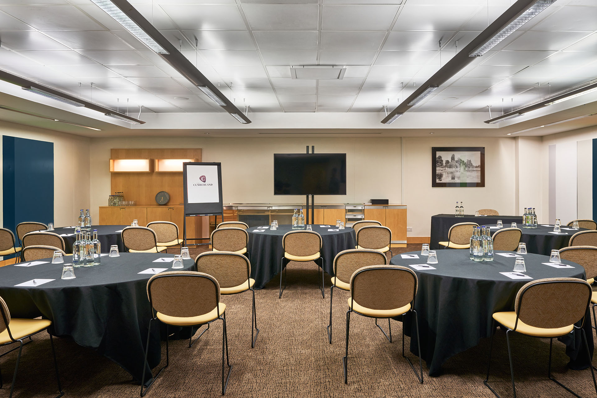 Meeting room at The Cumberland Hotel with dark linens, ideal for corporate events. - Banner