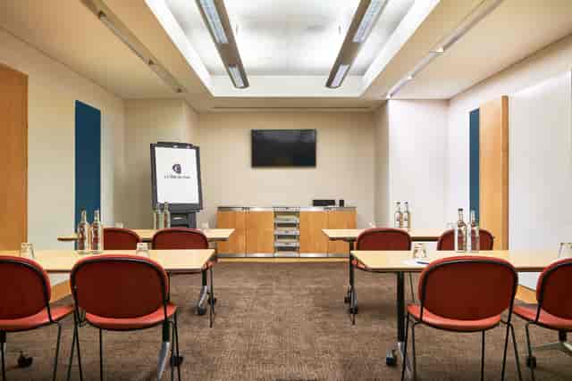 Meeting room at The Cumberland Hotel with modern furnishings for corporate events.