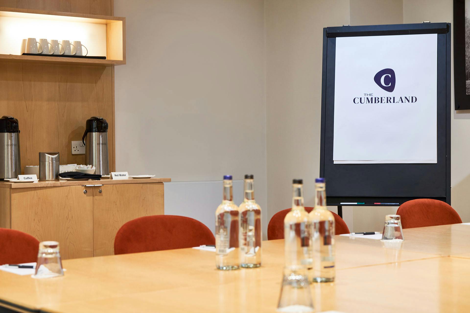 Meeting room at The Cumberland Hotel with polished table, ideal for corporate events.