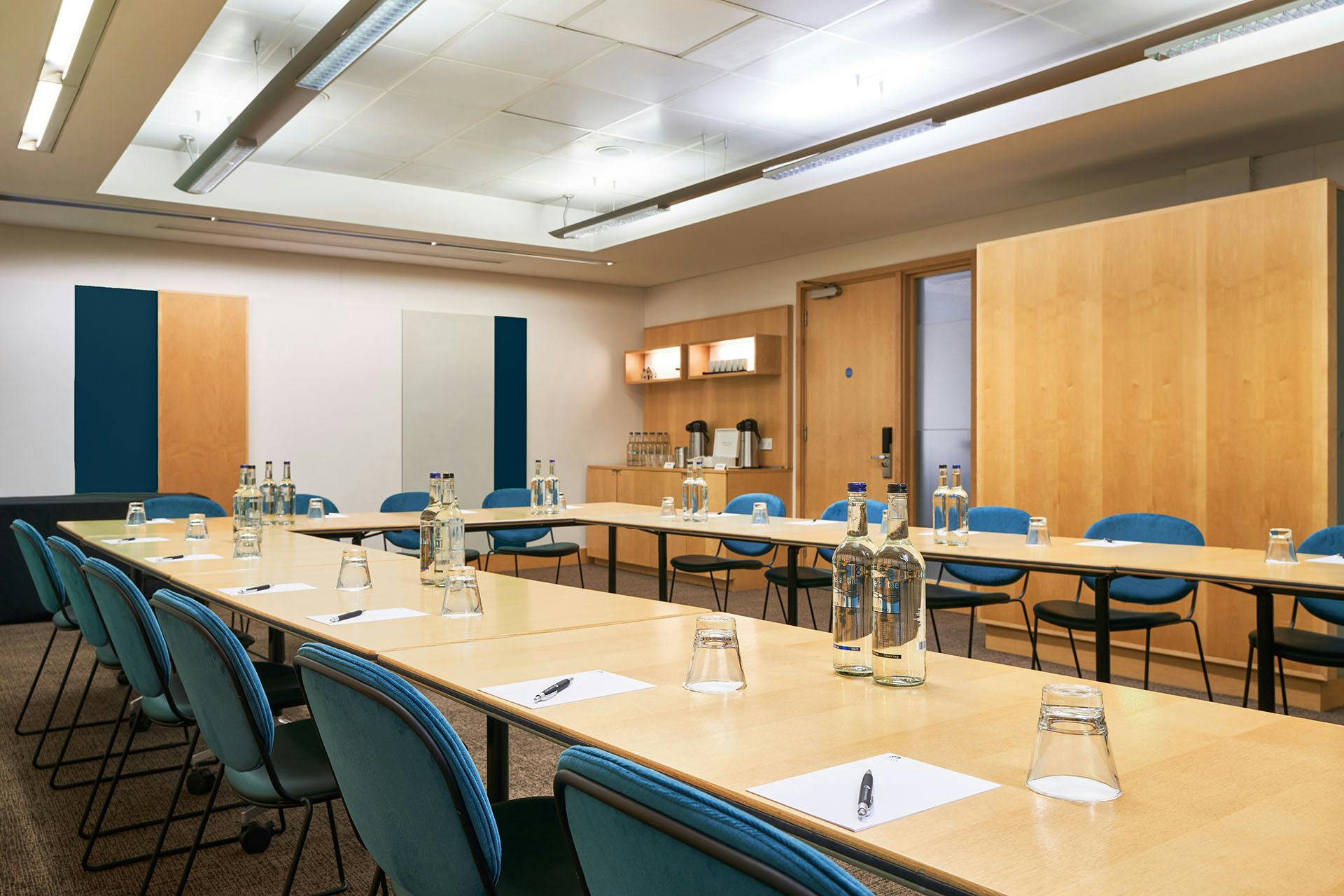 Meeting room at The Cumberland Hotel with long table, ideal for conferences and presentations.