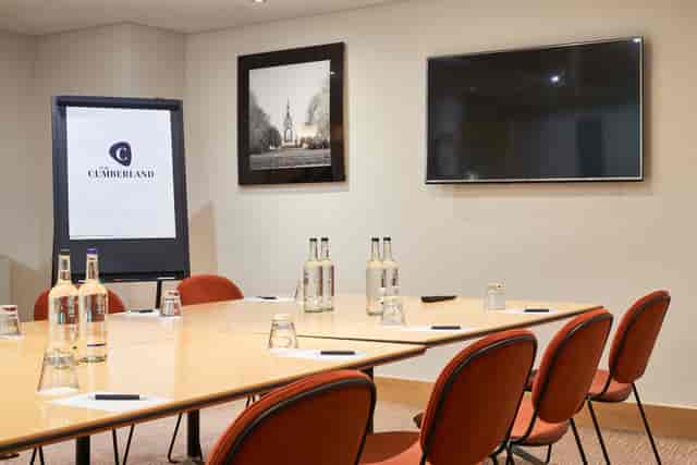 Meeting room at The Cumberland Hotel with large table, ideal for conferences and events.