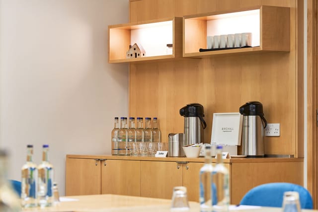 Meeting space in The Cumberland Hotel with wooden sideboard and refreshments.