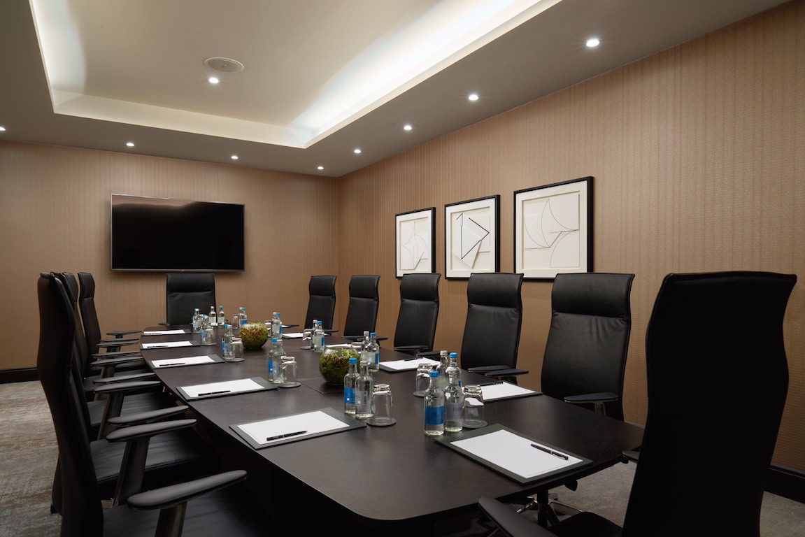 Modern conference room at Hilton London Bankside, ideal for professional meetings and events. - Banner