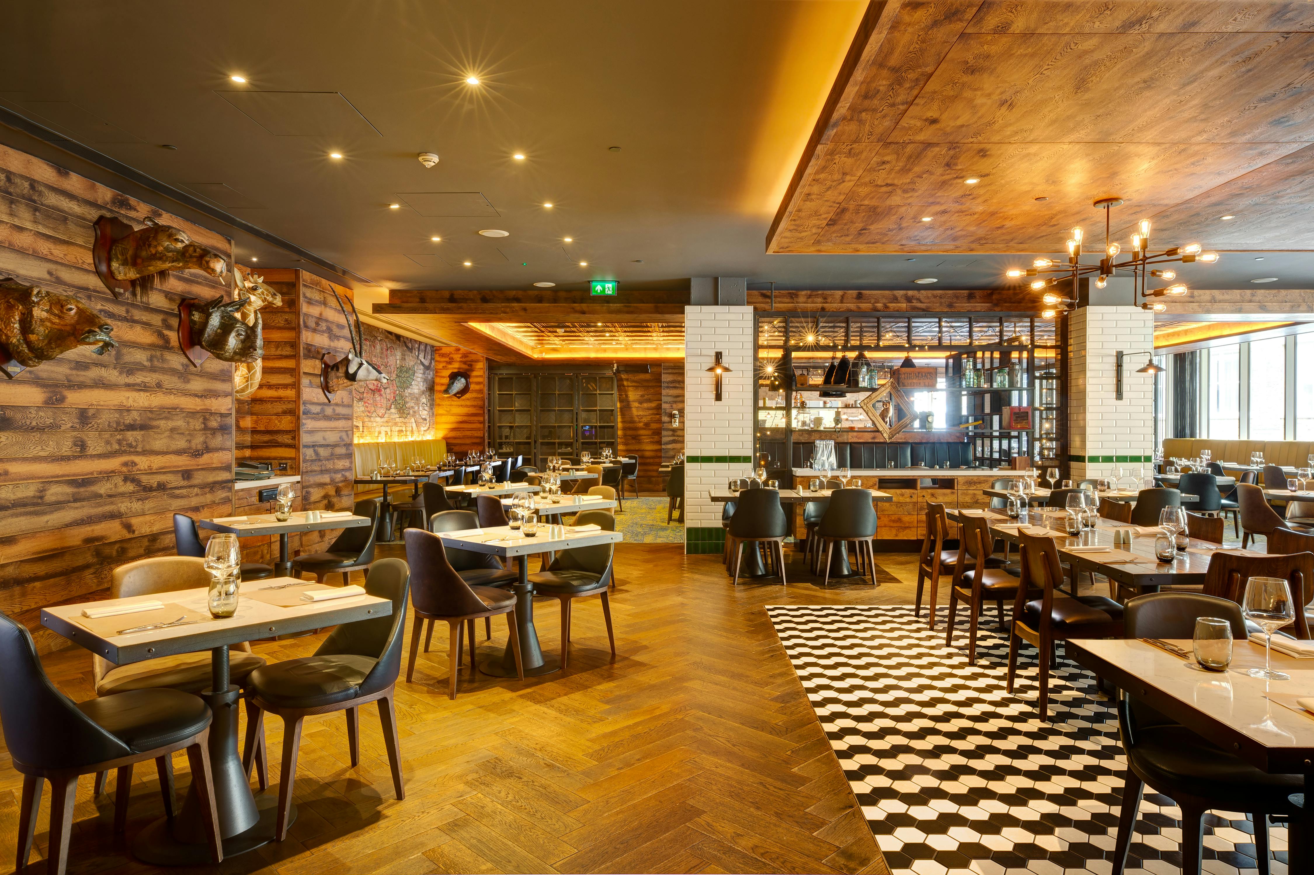 Stylish OXBO Restaurant in Hilton London, perfect for events and gatherings.