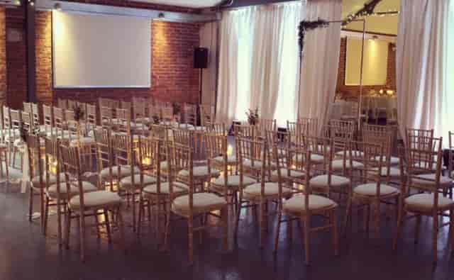 New Craven Hall industrial-chic venue set for corporate presentation or elegant ceremony.