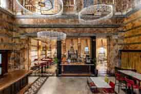 Elegant event space at Boyds Grill & Wine Bar with marble walls for corporate meetings.