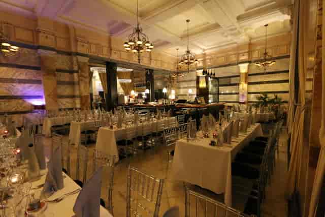 Elegant event space at Boyds Grill & Wine Bar with chandeliers for corporate gatherings.