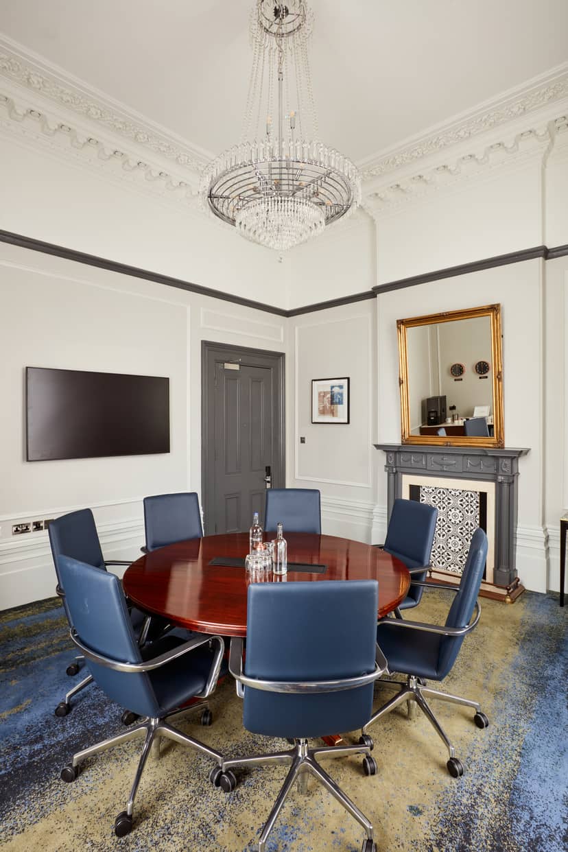 Venetian Meeting Room at Clermont Victoria with round table for professional gatherings.