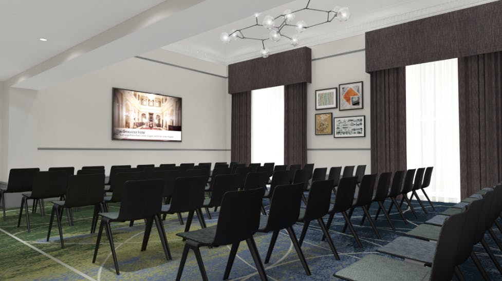 Modern meeting room with black chairs, ideal for seminars and presentations.