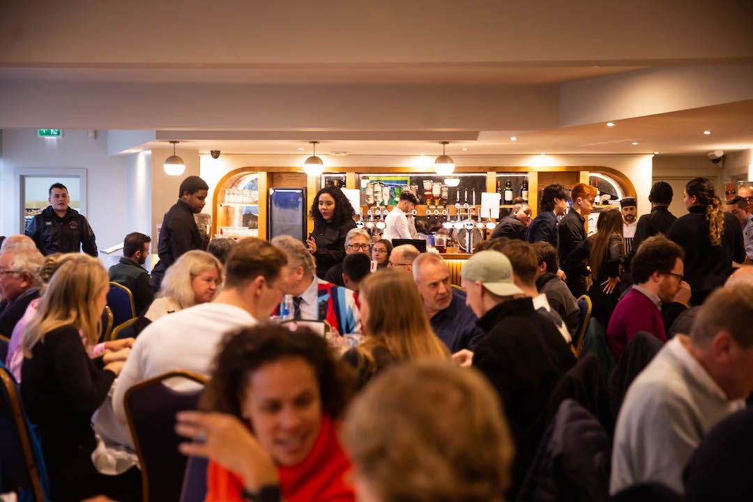 Club Room at Richmond Athletic Ground, bustling event space for networking and collaboration.