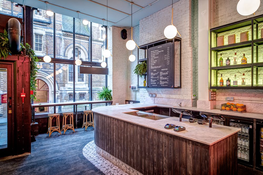 Stylish Covent Garden venue with modern bar, ideal for networking events and gatherings.