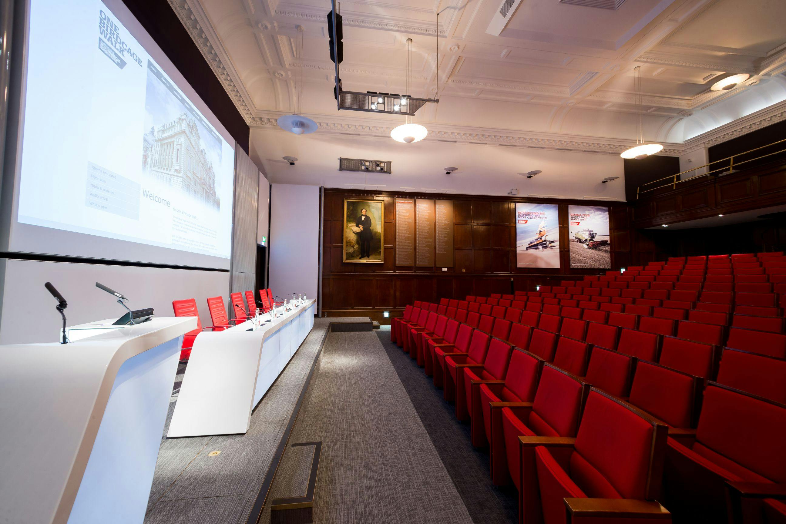 Lecture Theatre at One Birdcage Walk with red seating, ideal for corporate seminars.