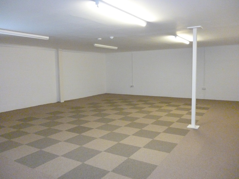 Spacious empty meeting room in Deanwood Barn for workshops and seminars.