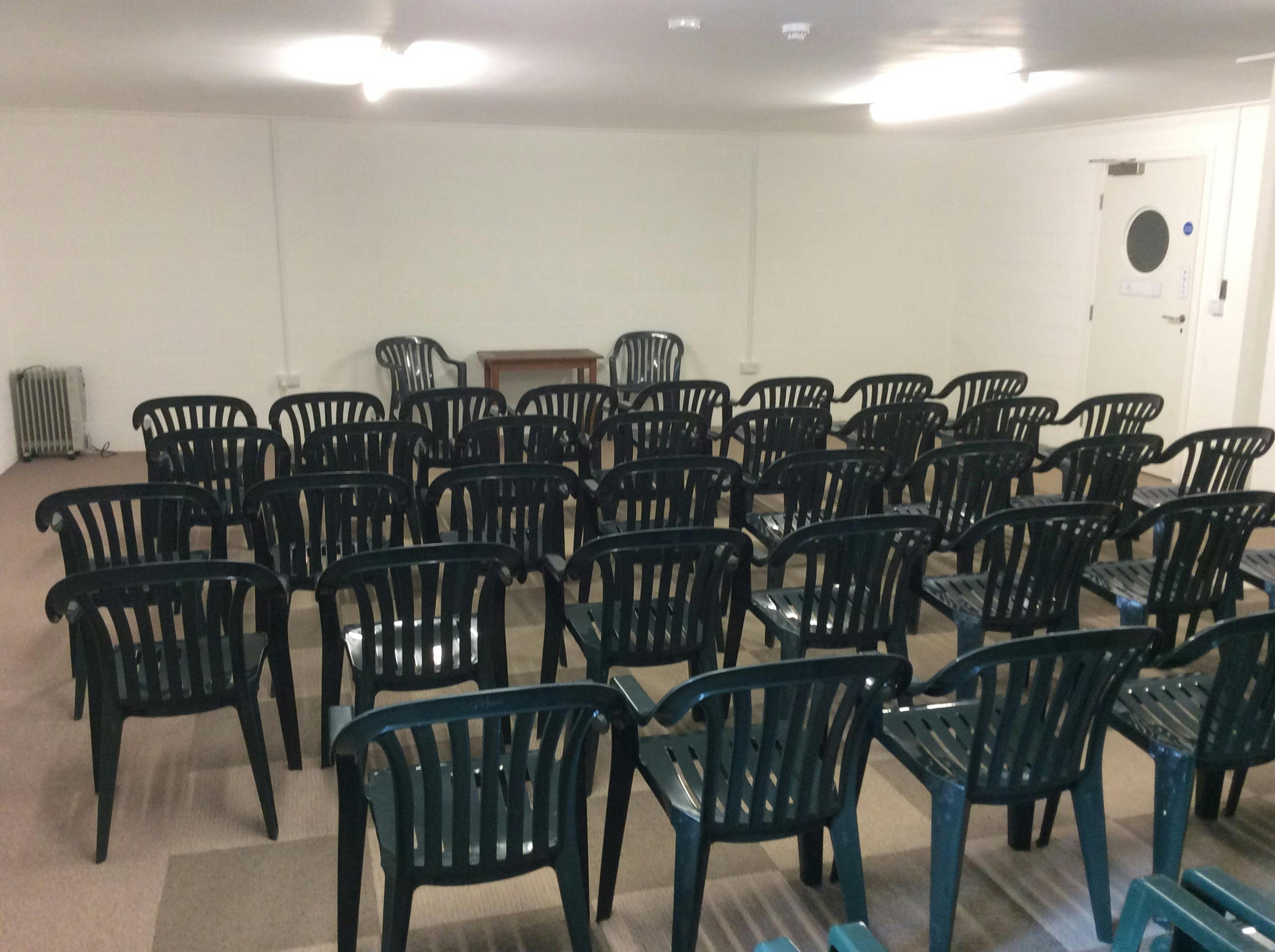 Meeting Room N1 at Deanwood Barn, featuring rows of chairs for casual gatherings.