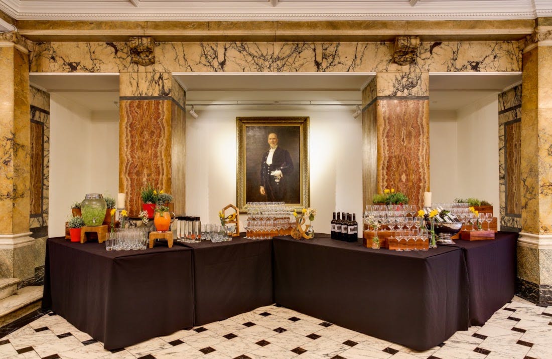 Elegant Marble Hall refreshment station for networking and social events.