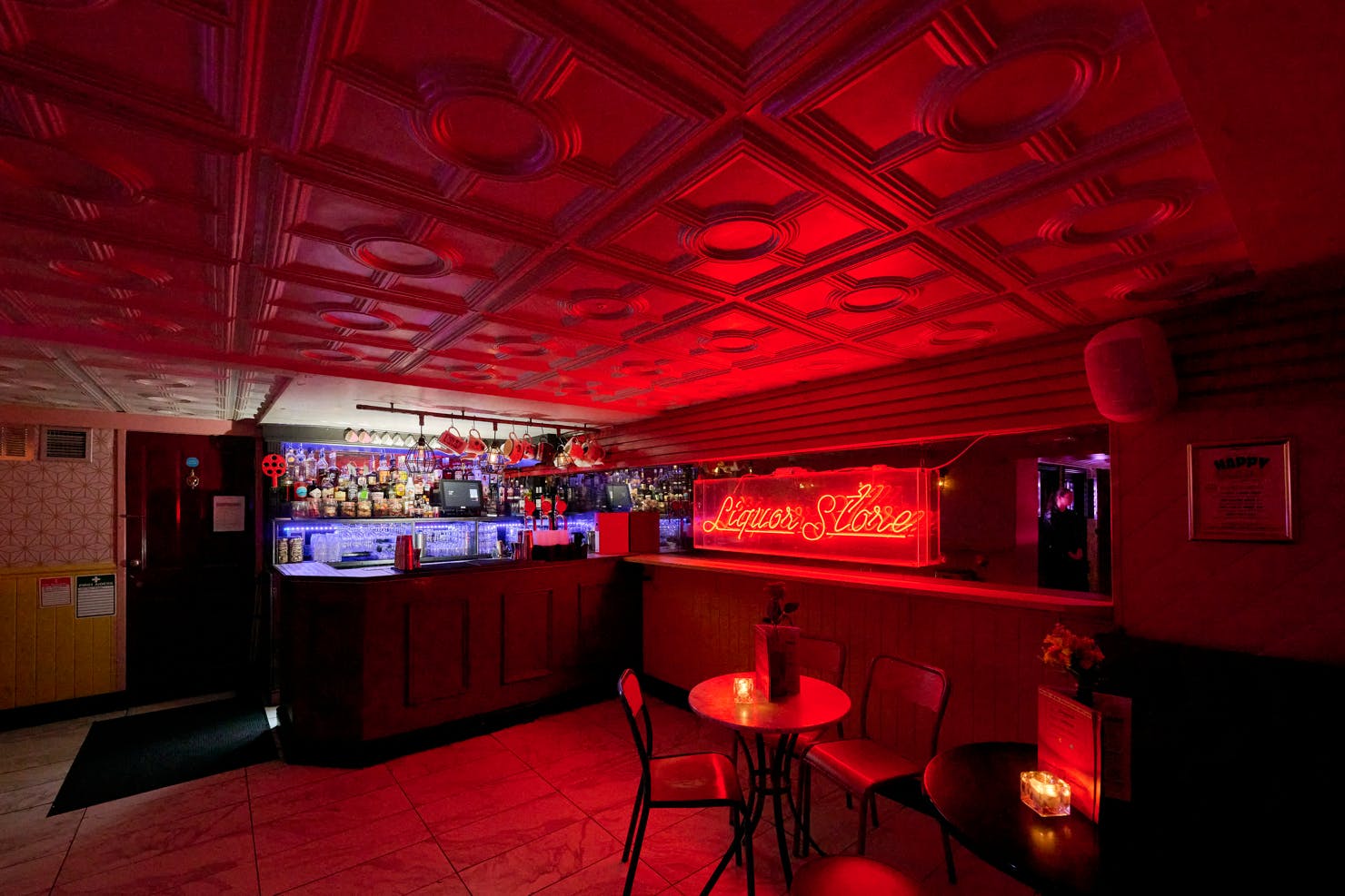 Stylish Function Room bar with red ambiance, perfect for networking events and gatherings.