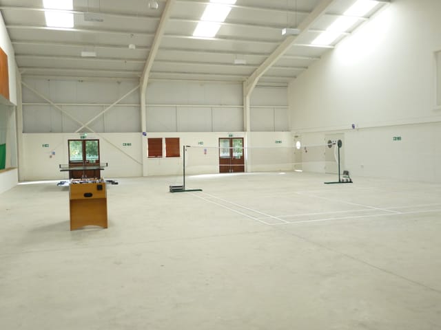 Spacious Sports Hall in Deanwood Barn, ideal for meetings and events with natural light.