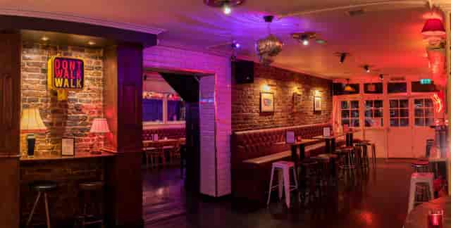 Stylish event space in Camden Town with exposed brick walls, perfect for networking events.