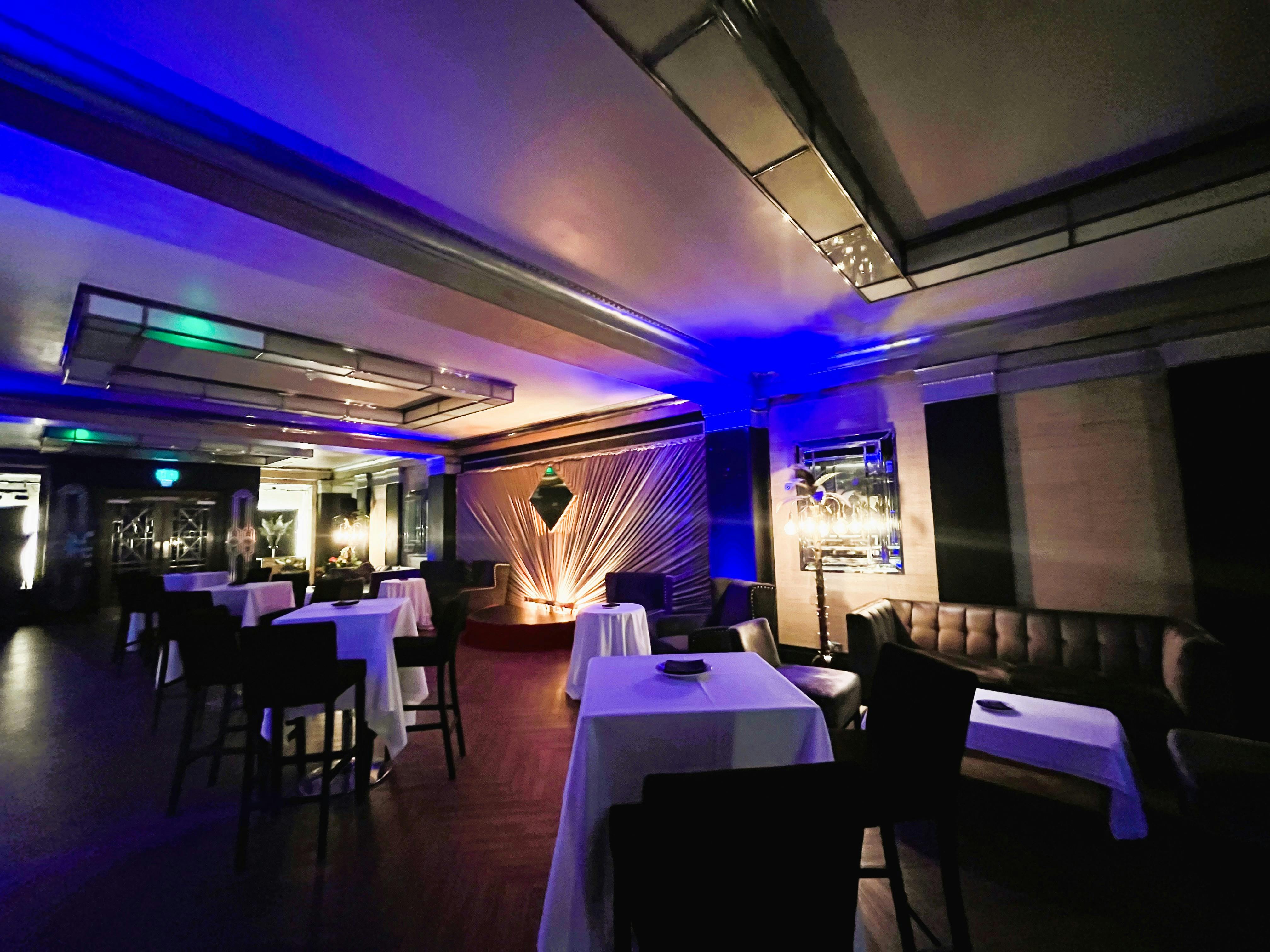 Elegant Rose Bar event space with ambient lighting for networking and social gatherings.