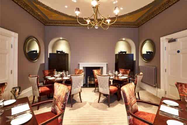 Elegant dining space in De Lys Room, perfect for upscale events and intimate meetings.