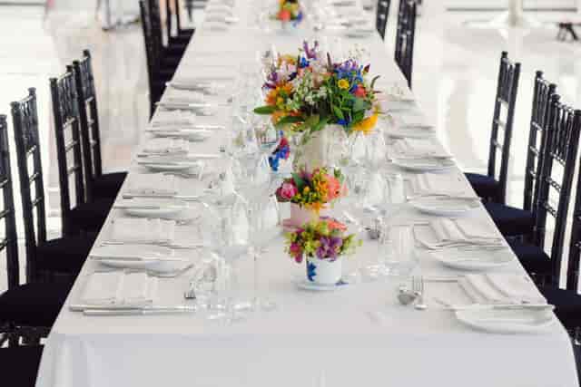 Elegant banquet table with vibrant flowers at Altitude 360 for weddings and events.