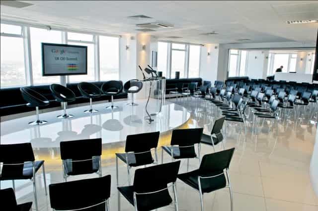 Altitude 360 event space with circular stage, ideal for conferences and networking.