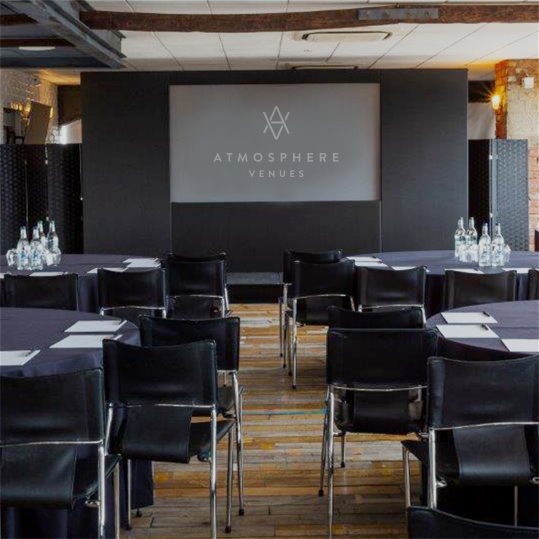 Skyloft meeting space in London with round tables, perfect for corporate events. - Banner