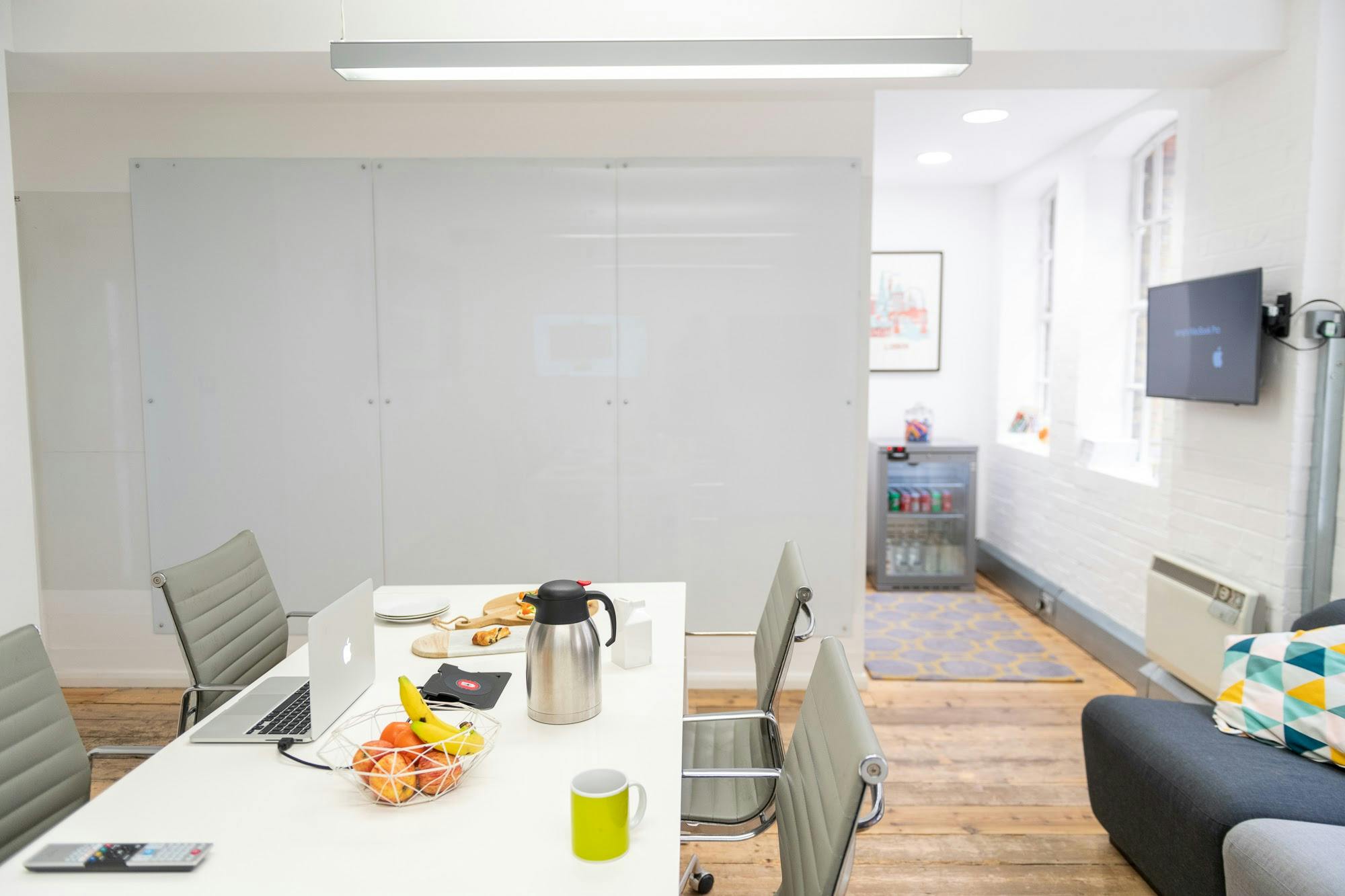 Modern meeting space in Sutherland Labs with sleek table, ideal for team brainstorming sessions.