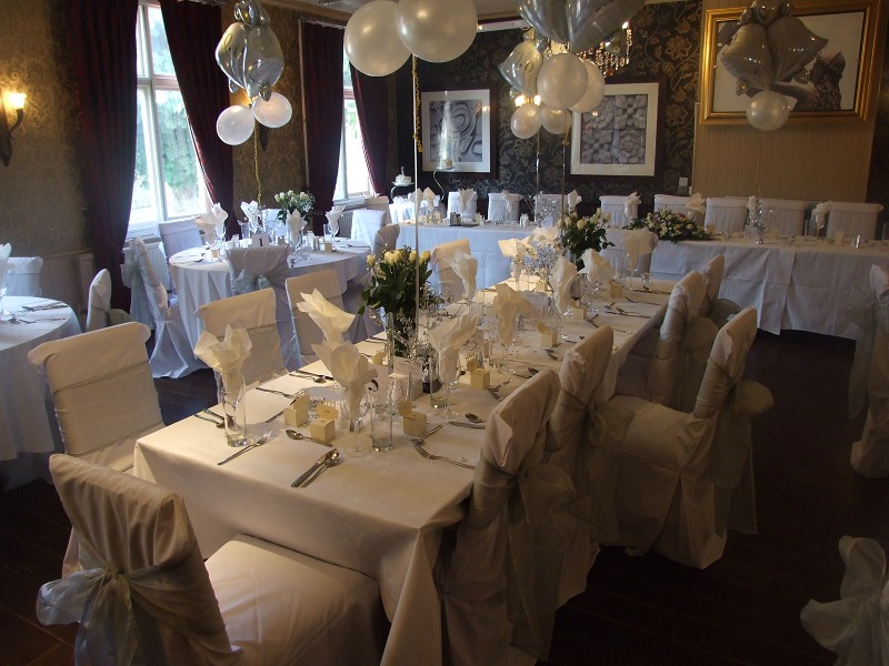 Windsor Room at The Crown Hotel with formal banquet setup for wedding or social event.