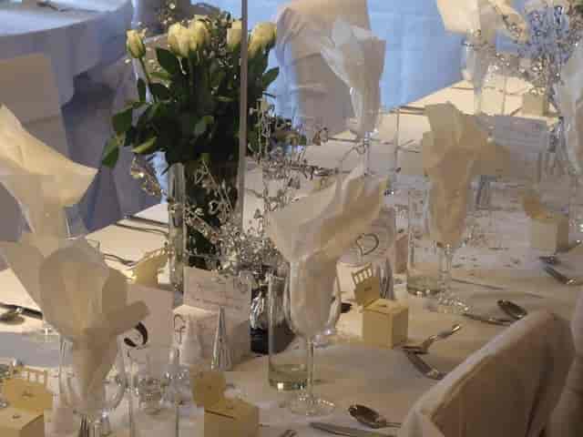 The Windsor Room at The Crown Hotel featuring elegant silver-accented wedding and gala decor.