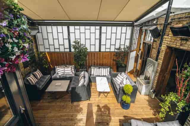 Stylish outdoor lounge at Karma Sanctum Soho, perfect for networking events and meetings.